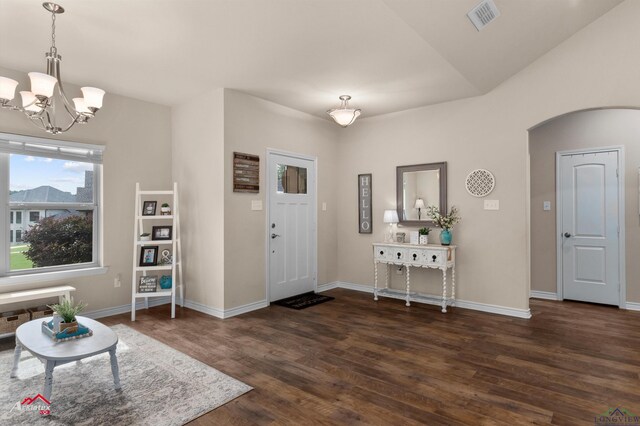 280 Towering Oaks Ln, Longview, TX 75602 - foyer with arched walkways, dark wood finished floors, a chandelier, and baseboards