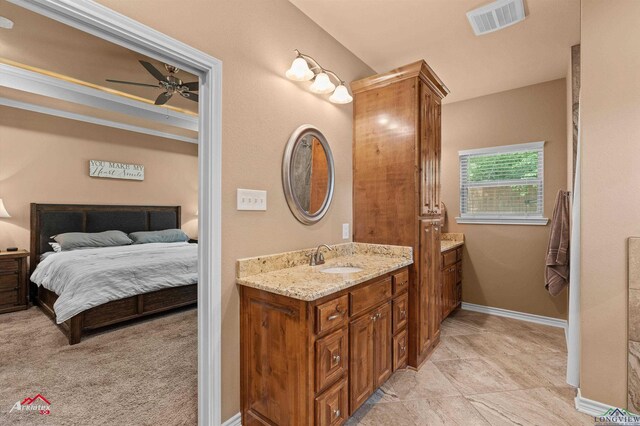 280 Towering Oaks Ln, Longview, TX 75602 - bathroom with ensuite bathroom, vanity, a ceiling fan, and baseboards
