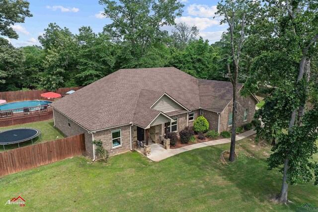280 Towering Oaks Ln, Longview, TX 75602 - view of front of home featuring brick siding, a patio area, and roof with shingles