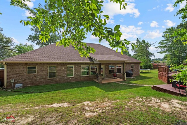 280 Towering Oaks Ln, Longview, TX 75602 - back of property with a shingled roof, brick siding, a patio area, and a deck
