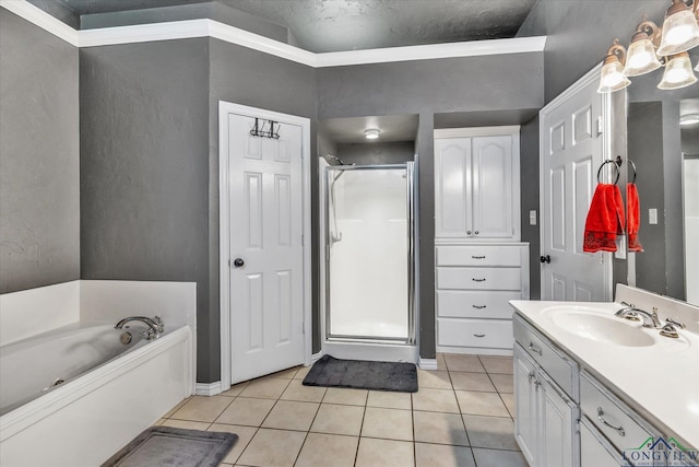 bathroom featuring a textured ceiling, tile patterned floors, independent shower and bath, and vanity