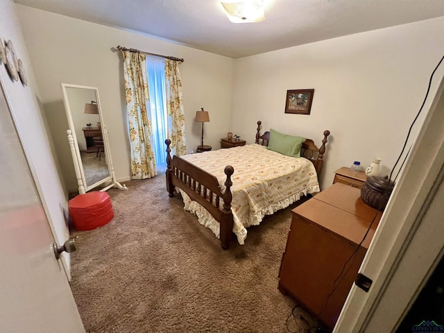 bedroom featuring dark colored carpet