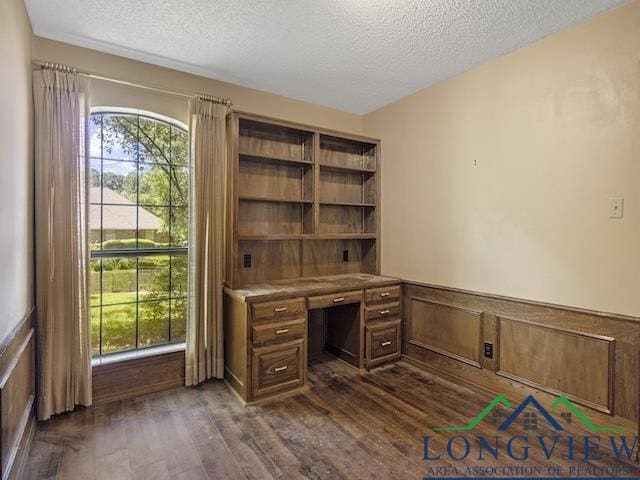 1204 Marigold Ln, Longview, TX 75604 - unfurnished office with a textured ceiling, dark wood finished floors, and wainscoting