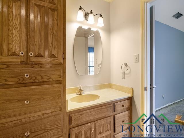 1204 Marigold Ln, Longview, TX 75604 - bathroom featuring vanity