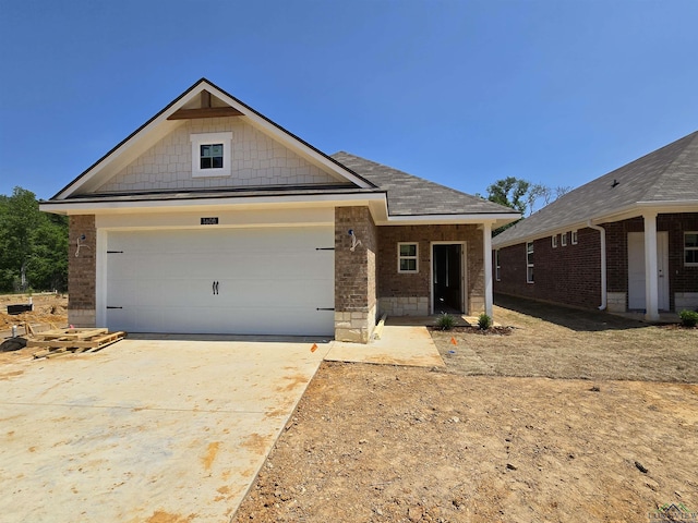 view of front of home with a garage and concrete driveway