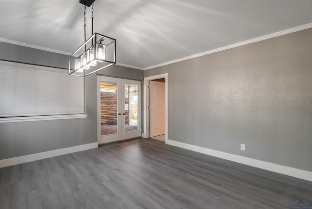 spare room with french doors, dark hardwood / wood-style flooring, and crown molding