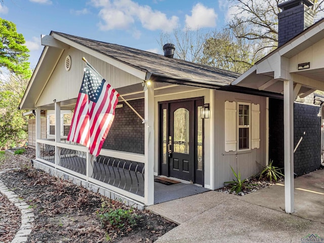 entrance to property with a porch