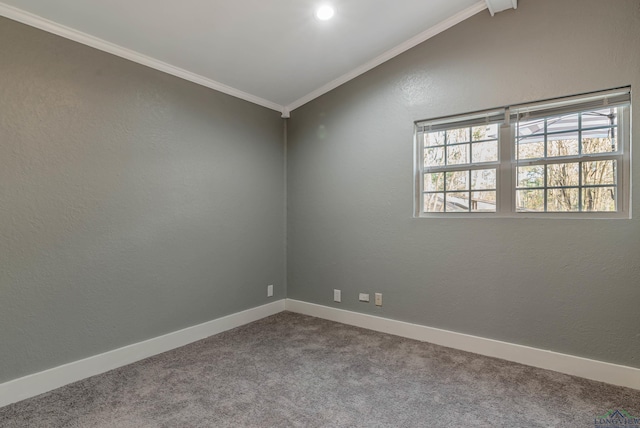 carpeted empty room with lofted ceiling and crown molding