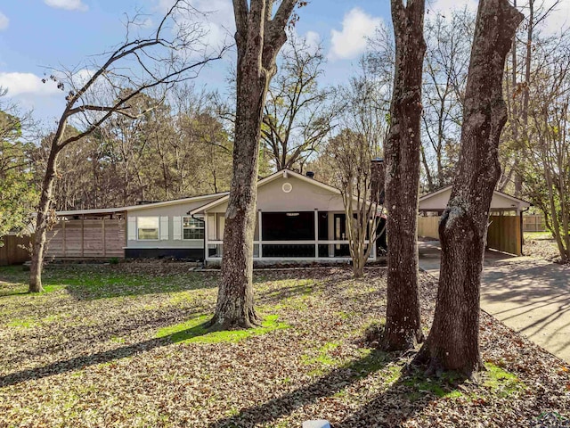 view of front of home featuring a sunroom