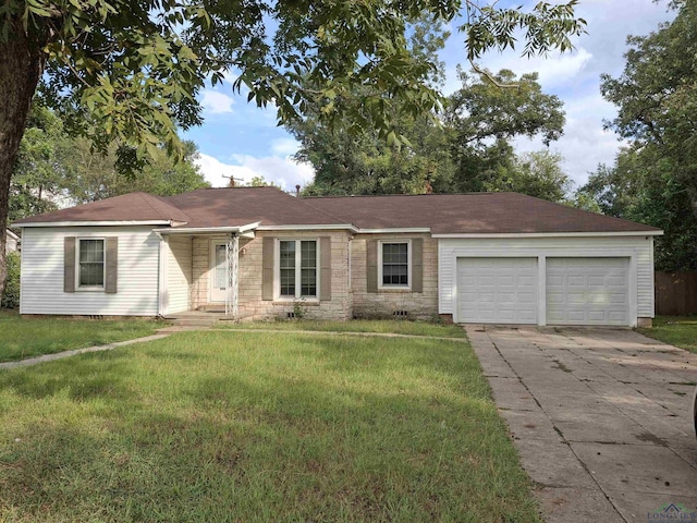 single story home with a front yard and a garage