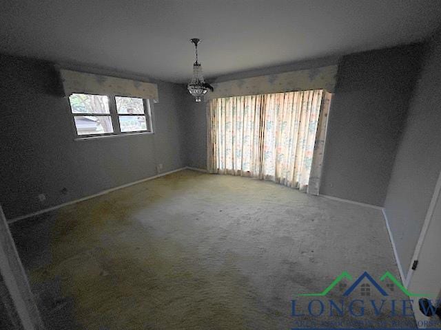 empty room featuring carpet flooring