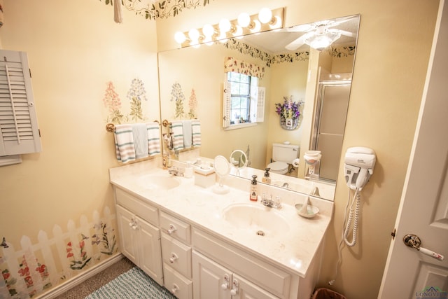 514 Buckeye Hill Rd, Karnack, TX 75661 - bathroom featuring ceiling fan, toilet, double vanity, and an enclosed shower