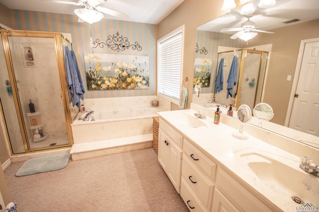 514 Buckeye Hill Rd, Karnack, TX 75661 - full bathroom featuring a ceiling fan, wallpapered walls, a shower stall, a bath, and double vanity