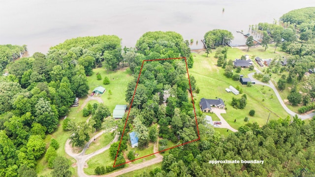 514 Buckeye Hill Rd, Karnack, TX 75661 - aerial overview of property's location with property parcel outlined and a tree filled landscape