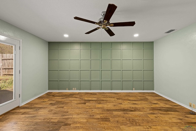 unfurnished room featuring recessed lighting, baseboards, ceiling fan, and wood finished floors