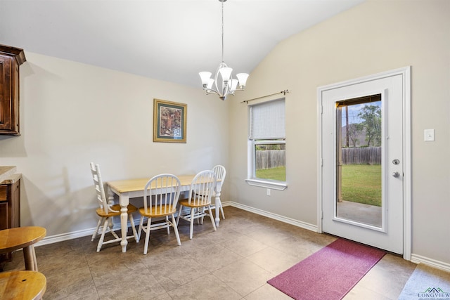 dining room with vaulted ceiling, baseboards, and an inviting chandelier