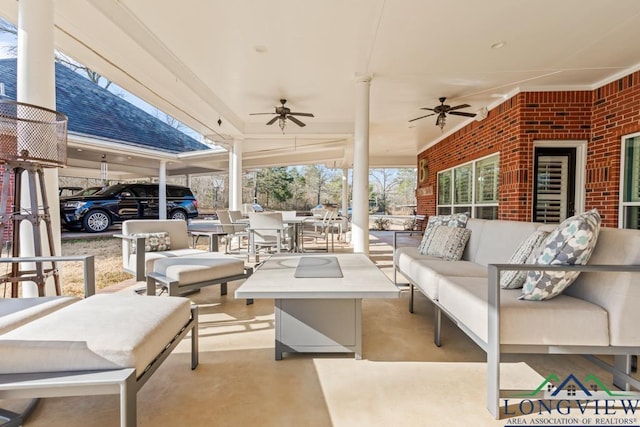 view of patio featuring an outdoor hangout area and ceiling fan