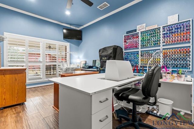 office with hardwood / wood-style floors, ceiling fan, and ornamental molding