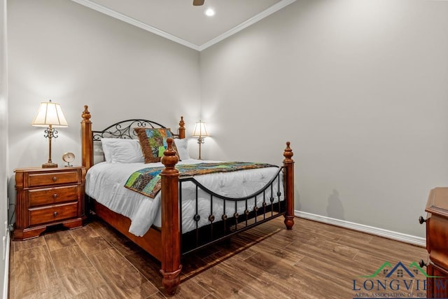 bedroom featuring hardwood / wood-style flooring, ceiling fan, and crown molding