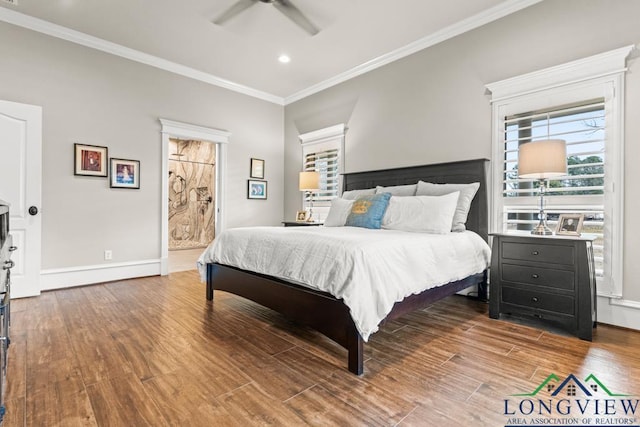 bedroom featuring connected bathroom, crown molding, wood-type flooring, and ceiling fan