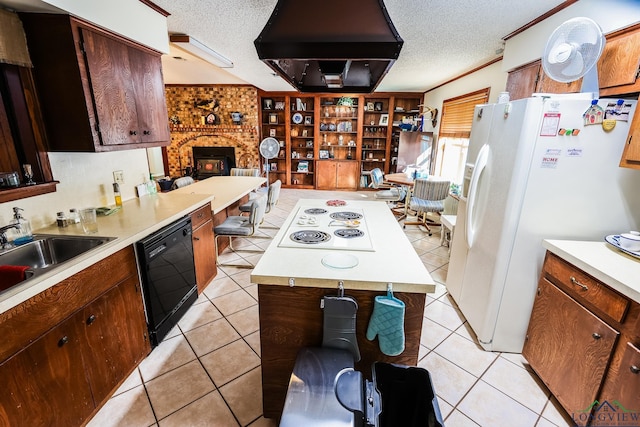 kitchen featuring white appliances, crown molding, sink, light tile patterned floors, and range hood