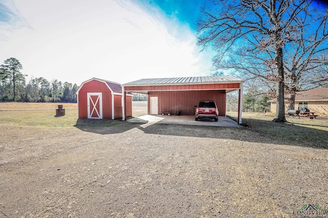 view of outbuilding featuring a carport