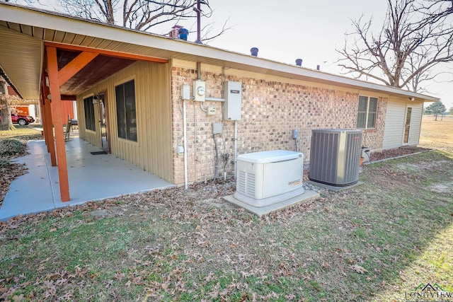 view of home's exterior featuring a patio area and cooling unit