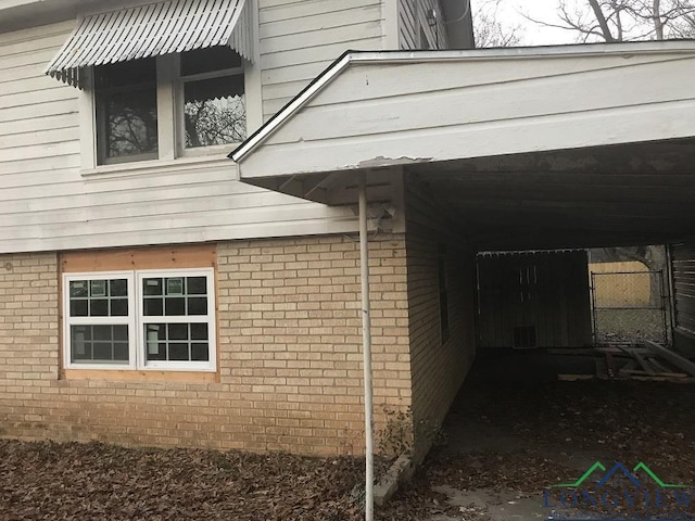 view of home's exterior featuring a carport