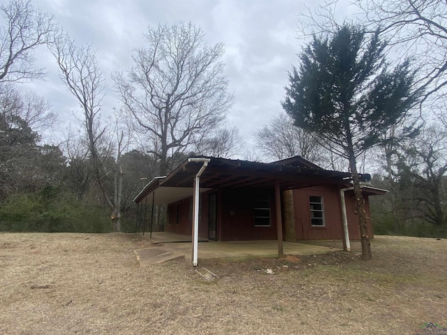 exterior space with a carport