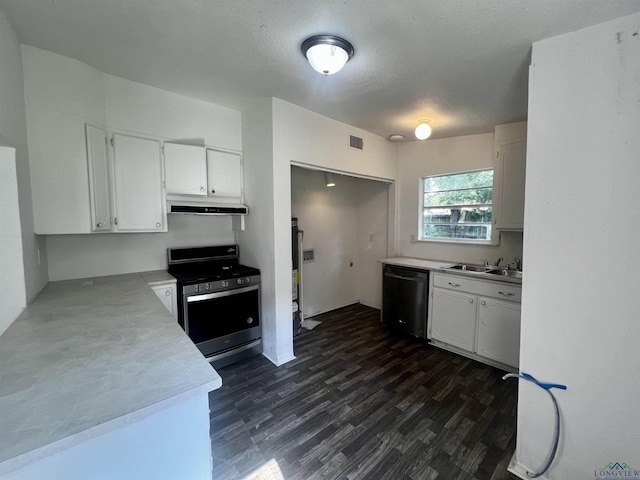 kitchen featuring sink, stainless steel range oven, black dishwasher, dark hardwood / wood-style floors, and white cabinetry