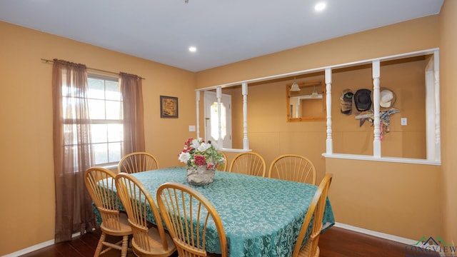 dining space with dark hardwood / wood-style floors