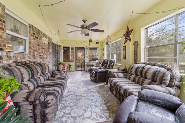 sunroom featuring ceiling fan