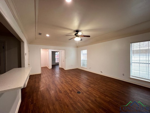 unfurnished living room with ceiling fan, ornamental molding, and dark hardwood / wood-style floors