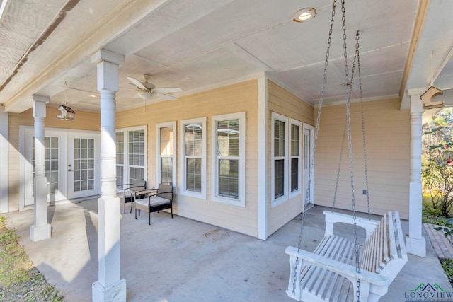 view of patio featuring ceiling fan and french doors