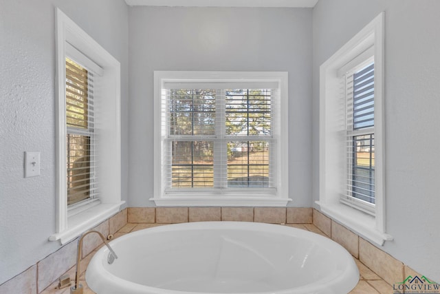 bathroom featuring a garden tub