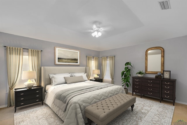 bedroom with a ceiling fan, a raised ceiling, visible vents, and baseboards