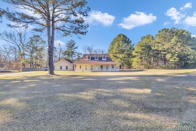 view of front facade featuring covered porch and a front lawn