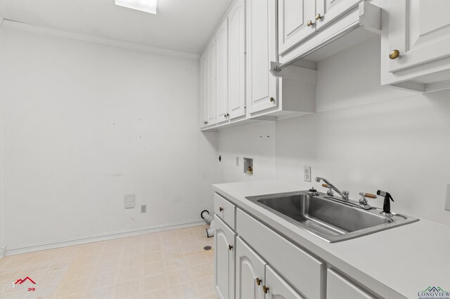825 University Dr, Carthage, TX 75633 - laundry room featuring cabinet space, hookup for a washing machine, light flooring, ornamental molding, and baseboards