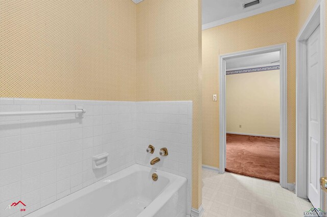 825 University Dr, Carthage, TX 75633 - full bath with a bath, ornamental molding, and baseboards