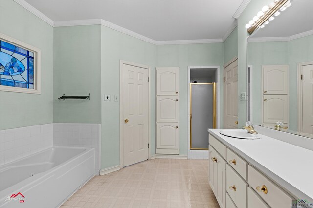 825 University Dr, Carthage, TX 75633 - full bathroom featuring vanity, a stall shower, a bath, tile patterned floors, and baseboards