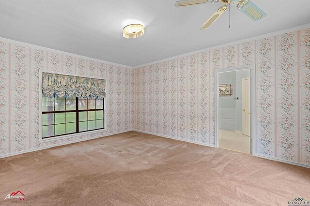 825 University Dr, Carthage, TX 75633 - carpeted spare room with crown molding and a ceiling fan