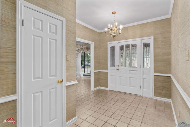 825 University Dr, Carthage, TX 75633 - entrance foyer with light tile patterned floors, a chandelier, crown molding, and wallpapered walls