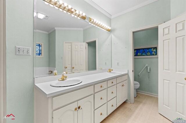 825 University Dr, Carthage, TX 75633 - bathroom with double vanity, crown molding, toilet, baseboards, and tile patterned floors