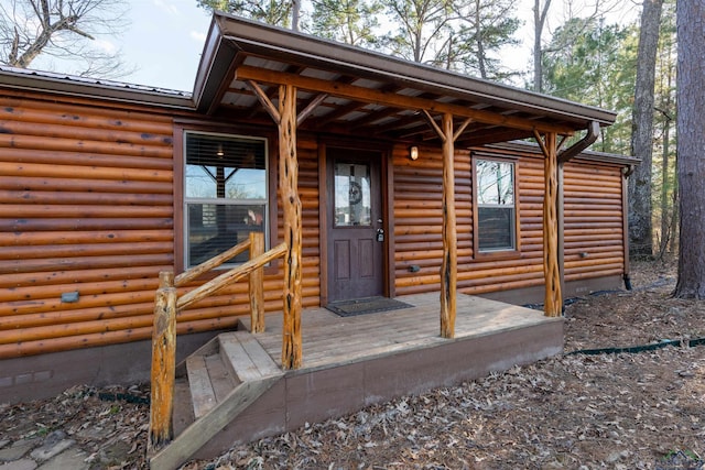 doorway to property with a deck