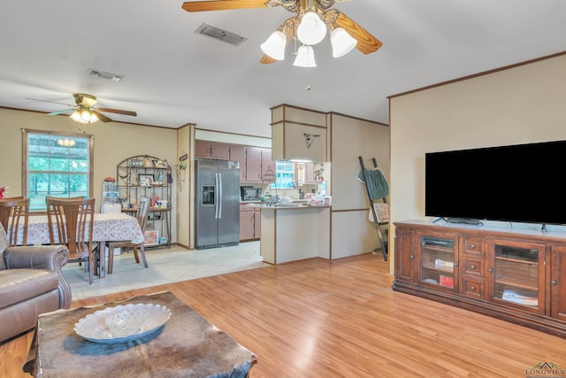 3738 Fm 161 S, Hughes Springs, TX 75656 - living area with ceiling fan and light wood-style flooring
