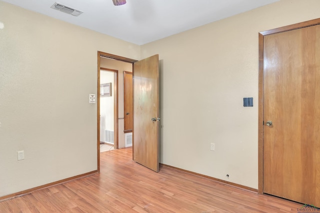 3738 Fm 161 S, Hughes Springs, TX 75656 - unfurnished bedroom with light wood finished floors and ceiling fan
