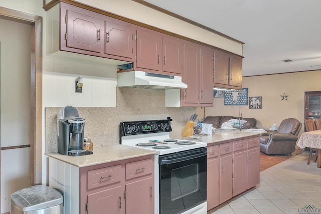 3738 Fm 161 S, Hughes Springs, TX 75656 - kitchen with electric stove, under cabinet range hood, light countertops, open floor plan, and light tile patterned flooring