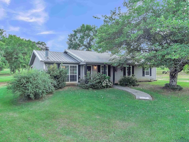 3738 Fm 161 S, Hughes Springs, TX 75656 - ranch-style house with a front yard, a metal roof, and a chimney