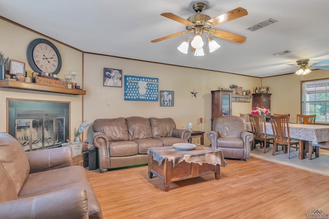 3738 Fm 161 S, Hughes Springs, TX 75656 - living area with a ceiling fan, light wood-type flooring, and ornamental molding