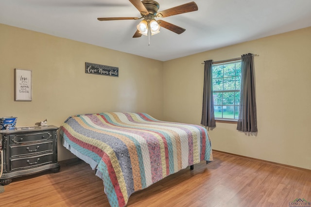 3738 Fm 161 S, Hughes Springs, TX 75656 - bedroom featuring wood finished floors and a ceiling fan